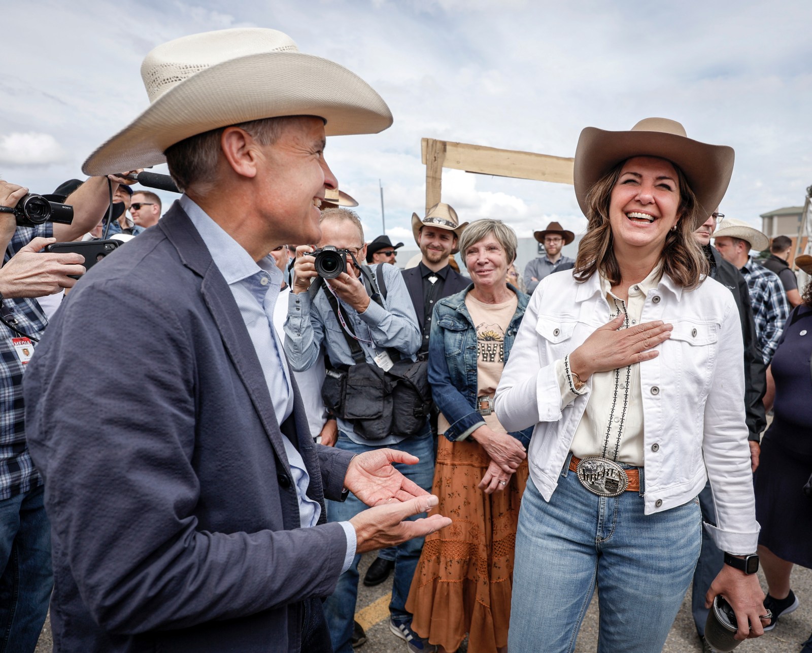 Alberta Premier Danielle Smith and Mark Carney at a public event, the original photograph used by Winnipeg Free Press